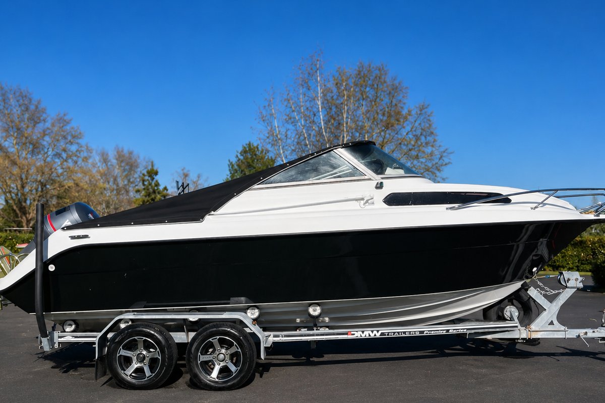 Cabin boat on a tandem trailer